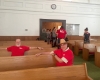 adults and children fellowship for vacation bible school in church pew